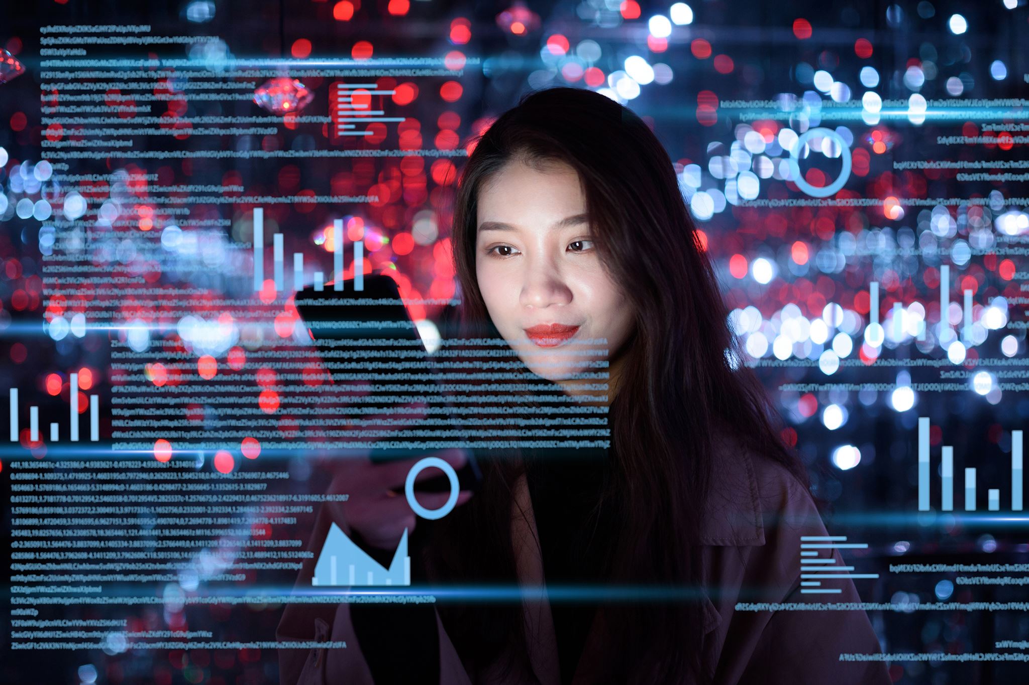 Woman-using-cell-phone-at-digital-data-science-display